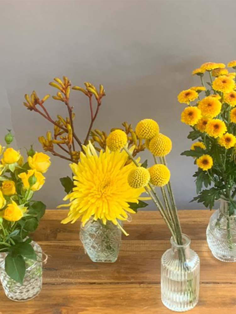 Yellow Blooms in ornate vases