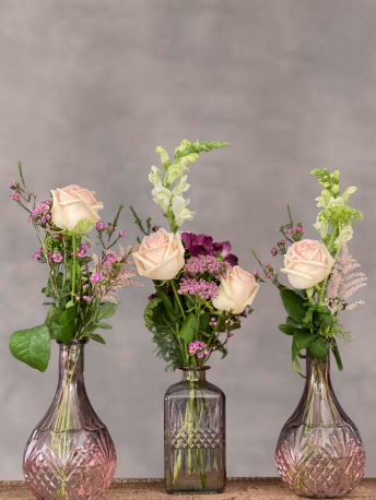 Pink Votive Table Centrepiece with Seasonal Flowers