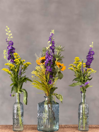 Blue Votive Table Centrepiece with Seasonal Flowers